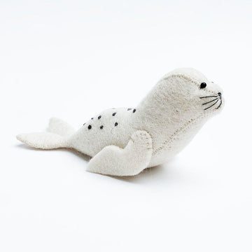 A Craftspring handmade white felt sunbather seal pup ornament