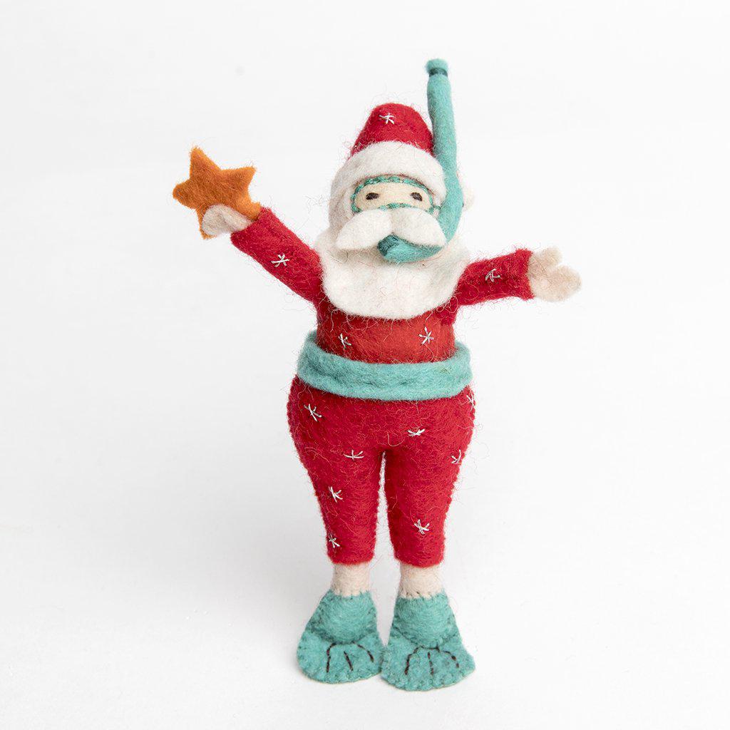 A Craftspring handmade tropical snorkel scuba santa ornament wearing a red scuba suit and holding a little orange starfish 