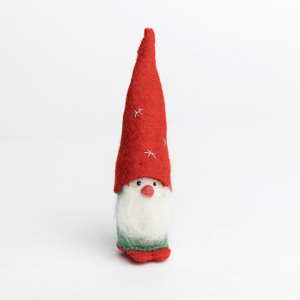 A Craftspring handmade felt twinkle tomte gnome ornament with a white beard and a little red nose, wearing a tall pointy red hat embroidered with silver stars
