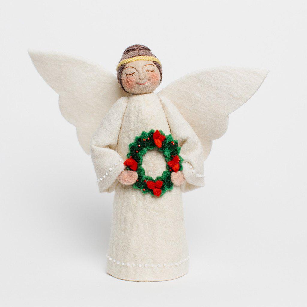 Craftspring handmade tree topper angel with brown hair in a bun, white wings, wearing a white dress, and holding a wreath with red flowers