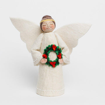 Craftspring handmade tree topper angel with brown hair in a bun, white wings, wearing a white dress, and holding a wreath with red flowers