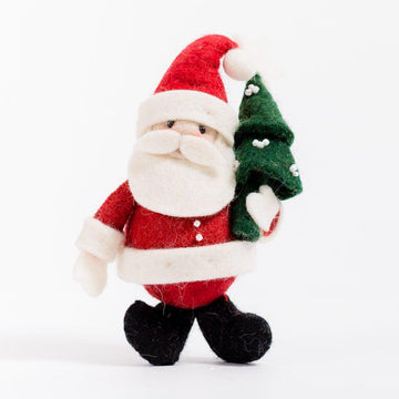 A Craftspring handmade felt santa ornament holding a small christmas tree
