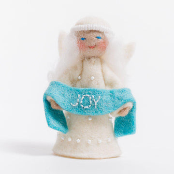 A Craftspring handmade felt angel ornament with a beaded dress white circlet and holding a blue sash embroidered with the word joy