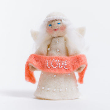 A Craftspring handmade felt angel ornament with a beaded dress white circlet and holding a pink sash embroidered with the word love
