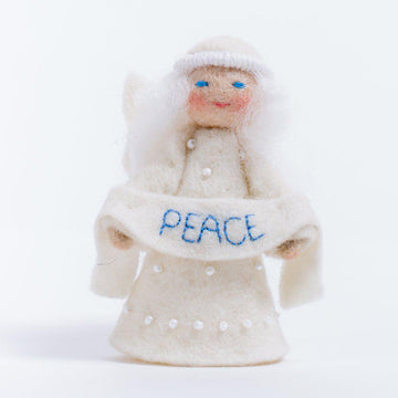 A Craftspring handmade felt angel ornament with a beaded dress white circlet and holding a white sash embroidered with the word peace