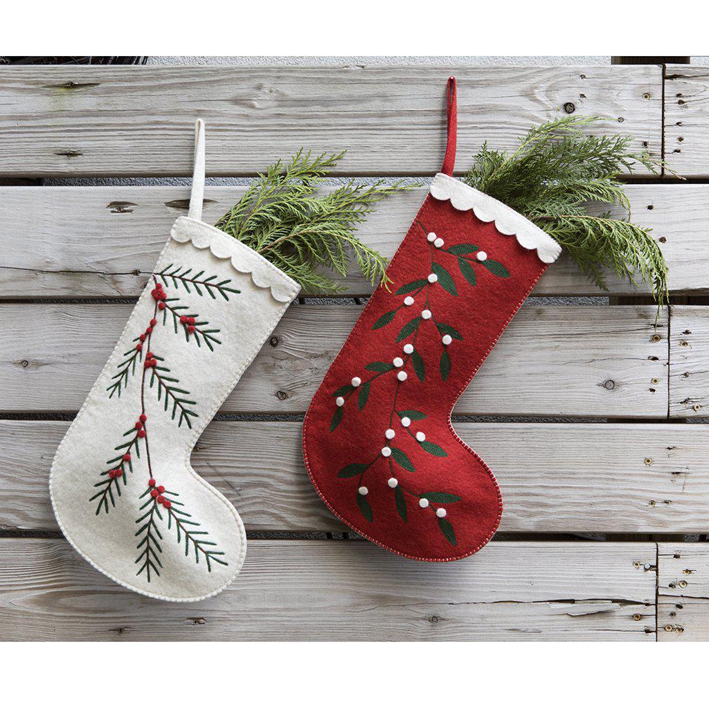 A Craftspring handmade red felt Christmas stocking with embroidered white berries and a white scalloped edge