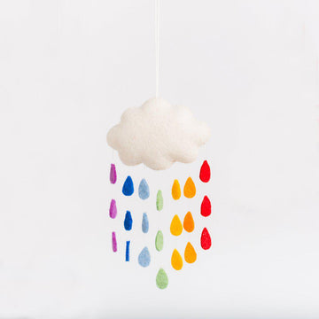 A Craftspring handmade felt cloud ornament with strings of rainbow raindrops